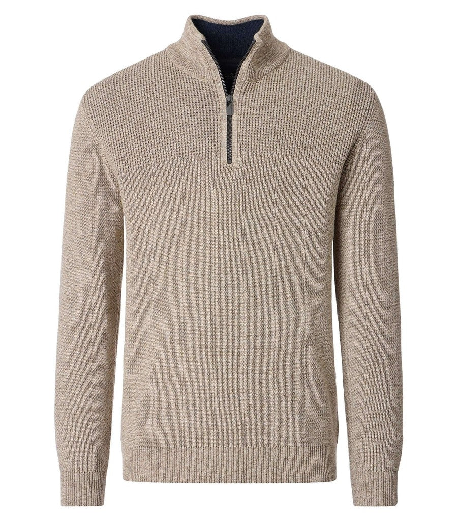 A men's ribbed knit quarter-zip sweater in a heathered taupe-beige color, featuring a mock neck collar with a dark zipper and a dark navy interior lining, shown against a plain white background.