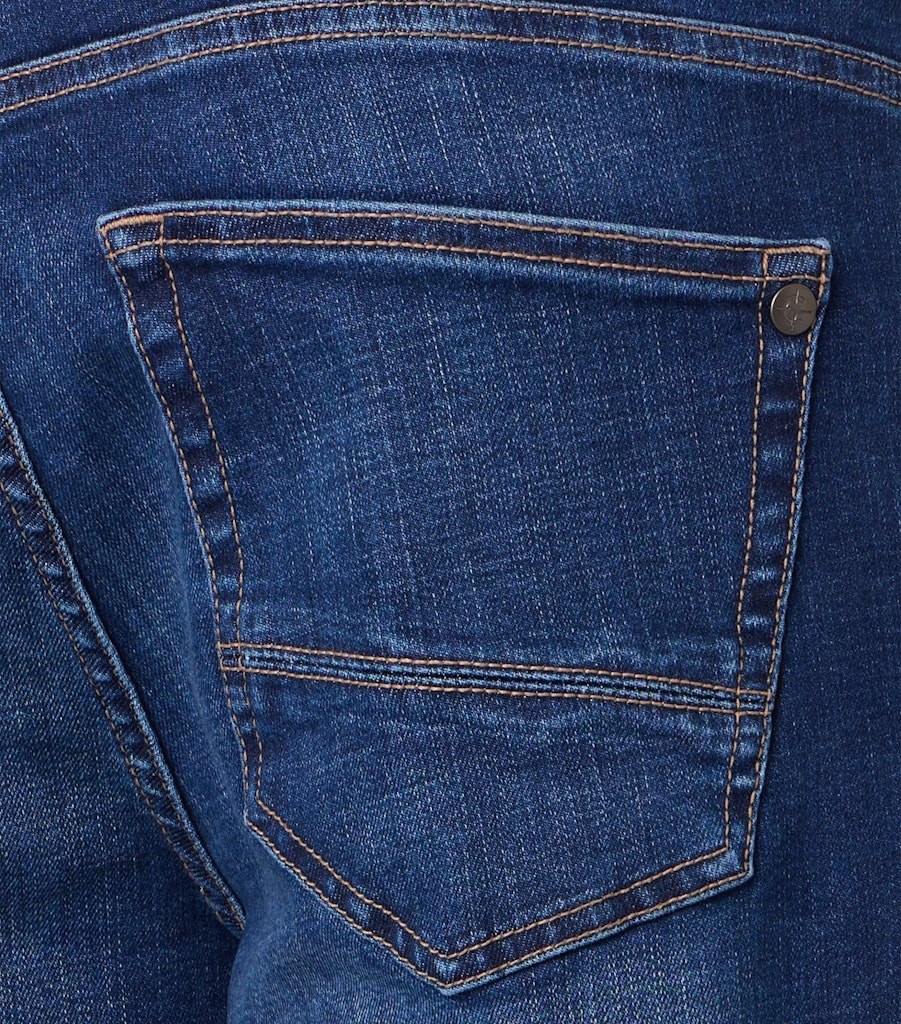 Close up of a jeans back pocket with tonal stitching and a small brand logo