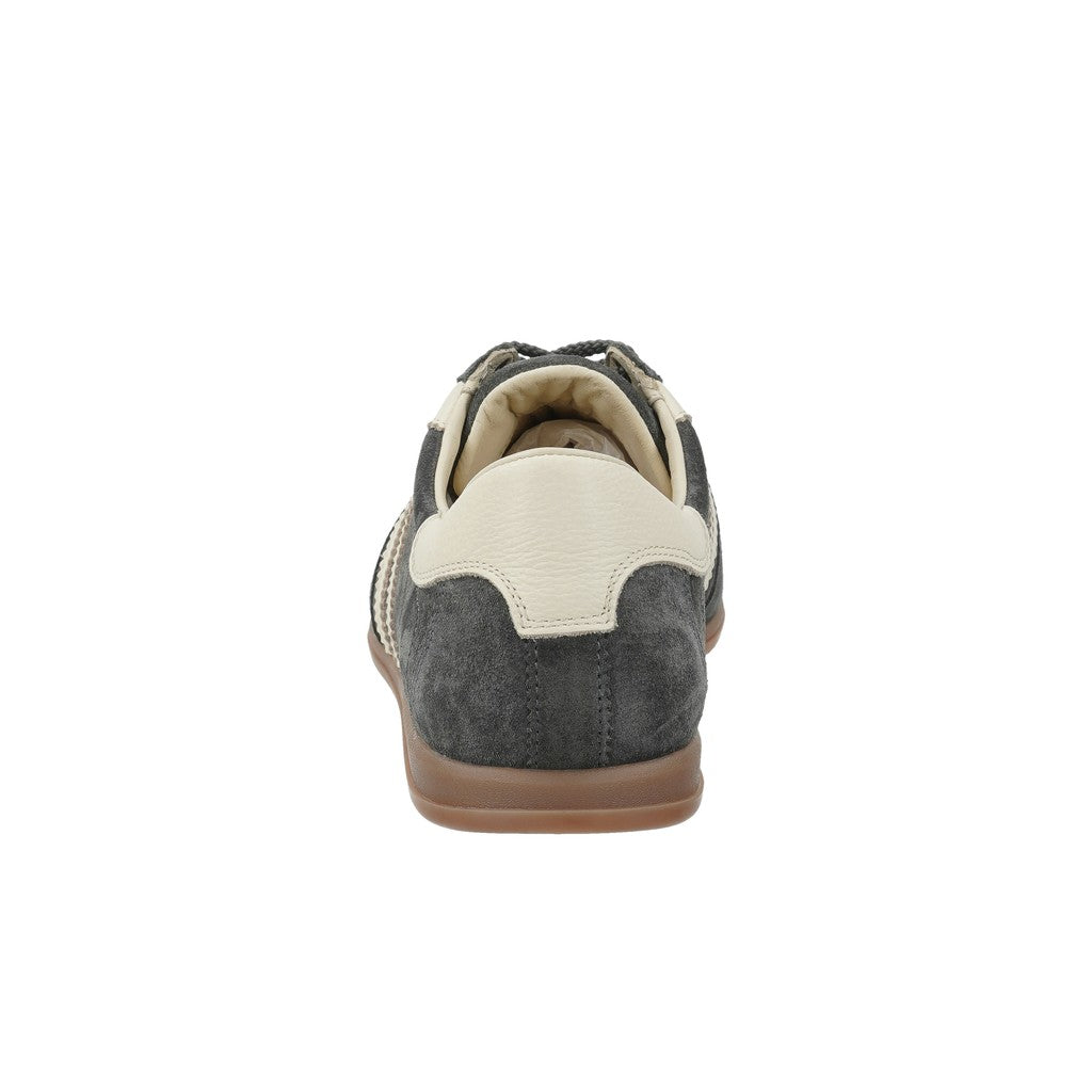 A single low-top sneaker shown from the rear three-quarter view, featuring dark gray suede panels, an off-white leather heel counter, cream laces, and a brown gum sole, set against a plain white background.