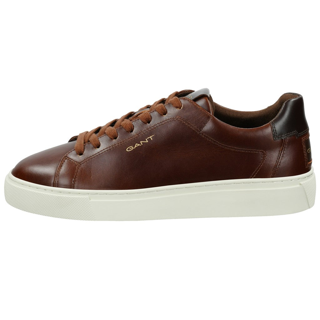 A GANT brown leather low-top sneaker with a thick off-white sole, brown laces, and a dark brown heel tab, shown from a side profile on a white background.