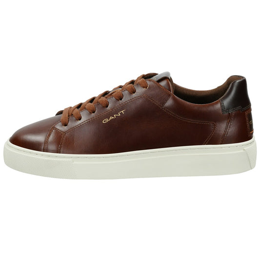 A GANT brown leather low-top sneaker with a thick off-white sole, brown laces, and a dark brown heel tab, shown from a side profile on a white background.