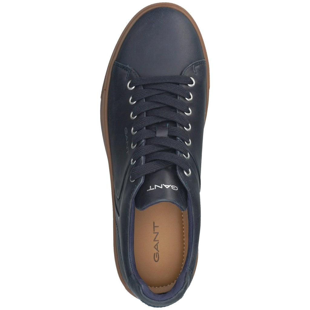 A single navy blue leather GANT sneaker shown from a top-down view, featuring navy laces, silver eyelets, and a brown outsole, on a solid white background.