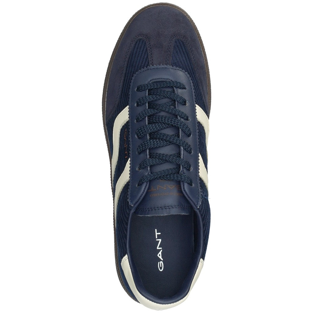A single GANT sneaker shown from a top-down view, featuring navy blue suede and cord panels with white side stripes and a brown sole.