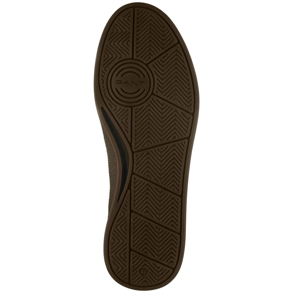 The outsole of a GANT shoe in dark brown rubber, showing the brand name embossed in the center circular tread pattern, on a solid white background.