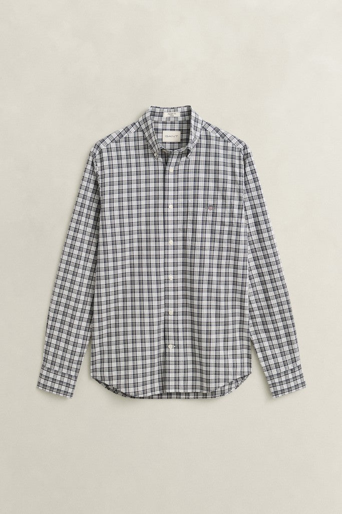 A long-sleeve button-up shirt with a small-scale black and white gingham plaid pattern, displayed flat against a light beige background.