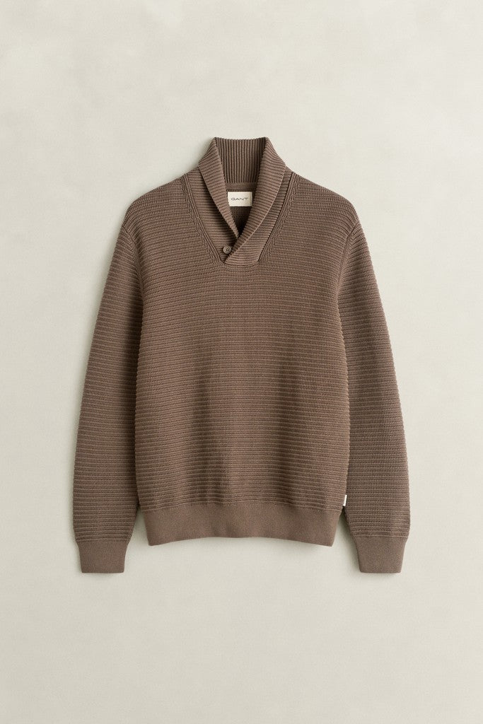 A ribbed knit sweater in a warm taupe-brown color, featuring a shawl collar and long sleeves, displayed flat against a light beige background.