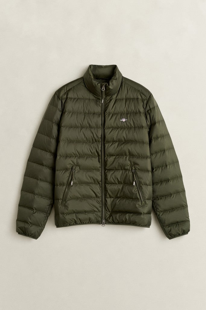 GANT puffer jacket in dark Green with small GANT logo on the left chest and zipped side pockets pictured flat against a light grey background