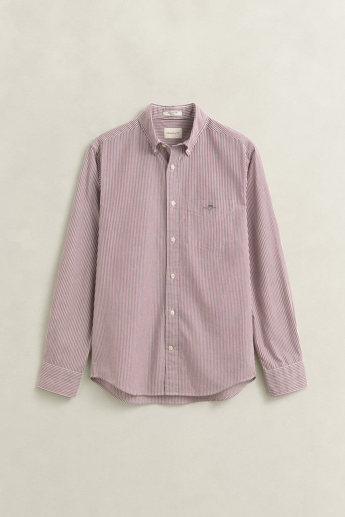 A long-sleeve button-down shirt in a light red and white micro stripe pattern, featuring a chest pocket with a small embroidered GANT logo, laid flat against a light beige background.