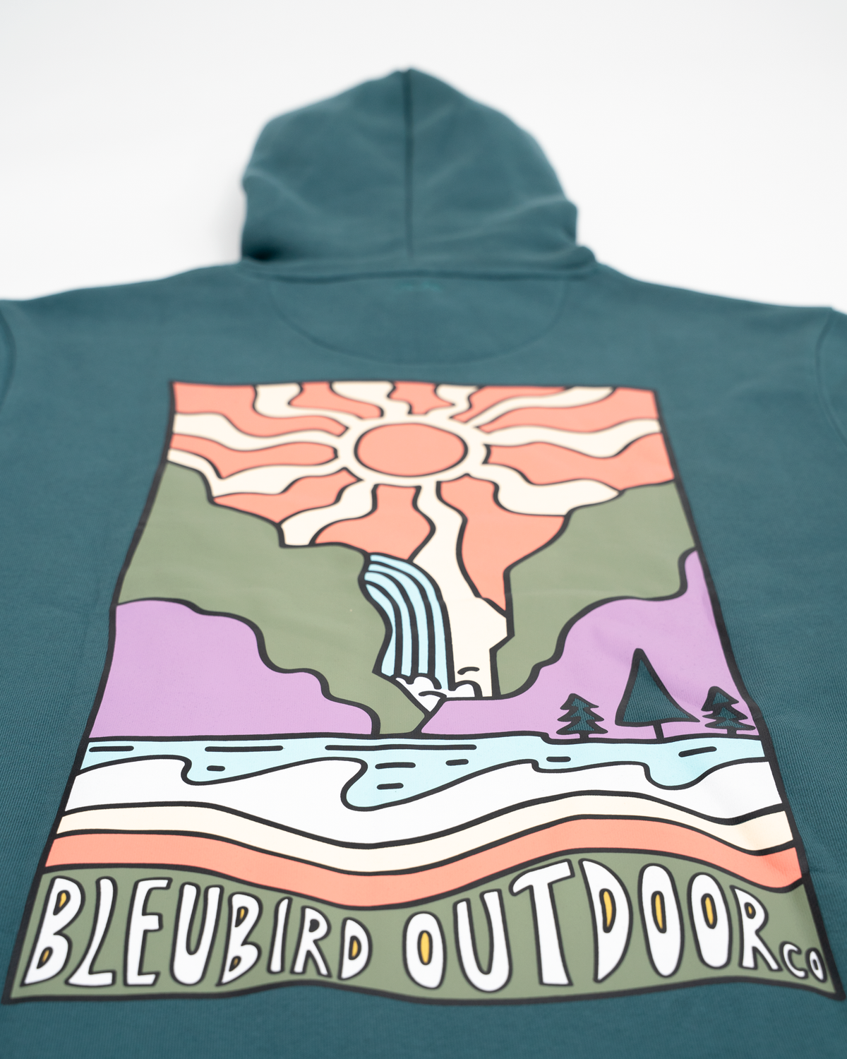 A teal blue-green hoodie shown from the back, featuring a large colorful graphic print of a sun, waterfall, mountains, trees, and water, with the text 'BLEUBIRD OUTDOOR CO' across the bottom.