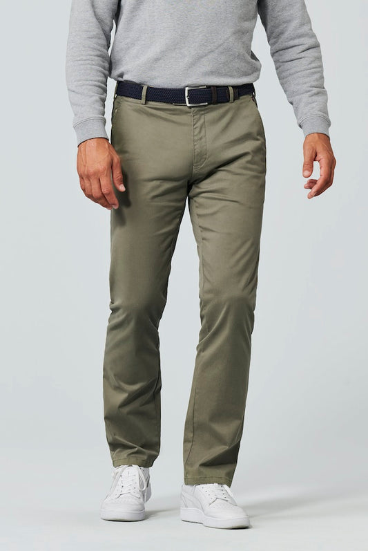 Person wearing olive green pants and a gray sweater on a white background