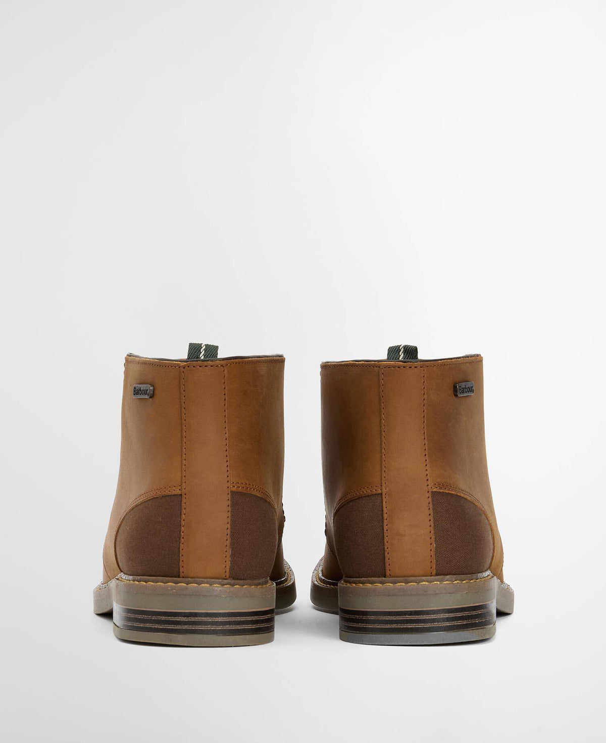 Heel view of a pair of brown leather boots on a light gray background