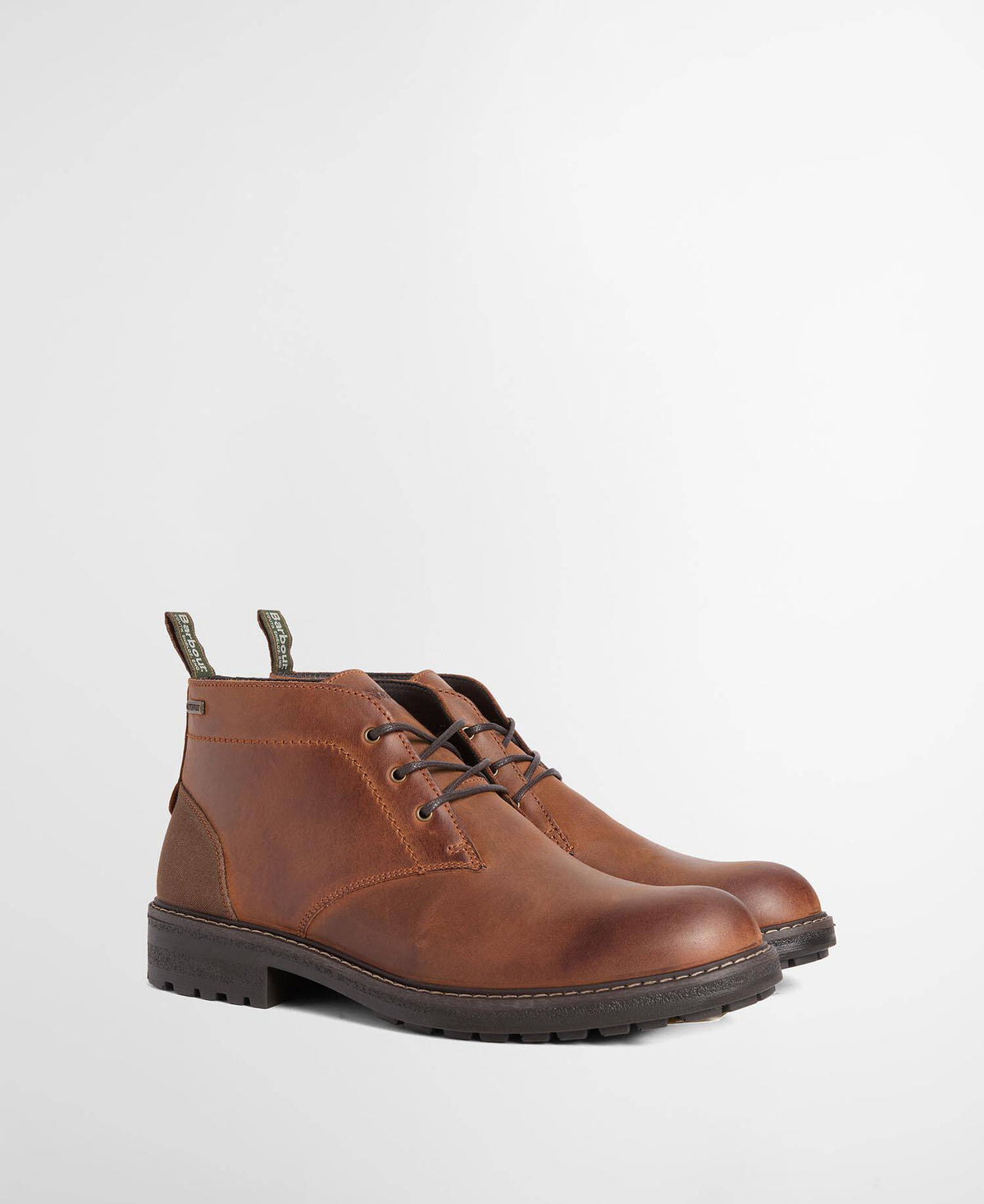 A pair of men's brown leather lace-up ankle boots with dark soles, shown from a three-quarters angle on a light gray studio background.