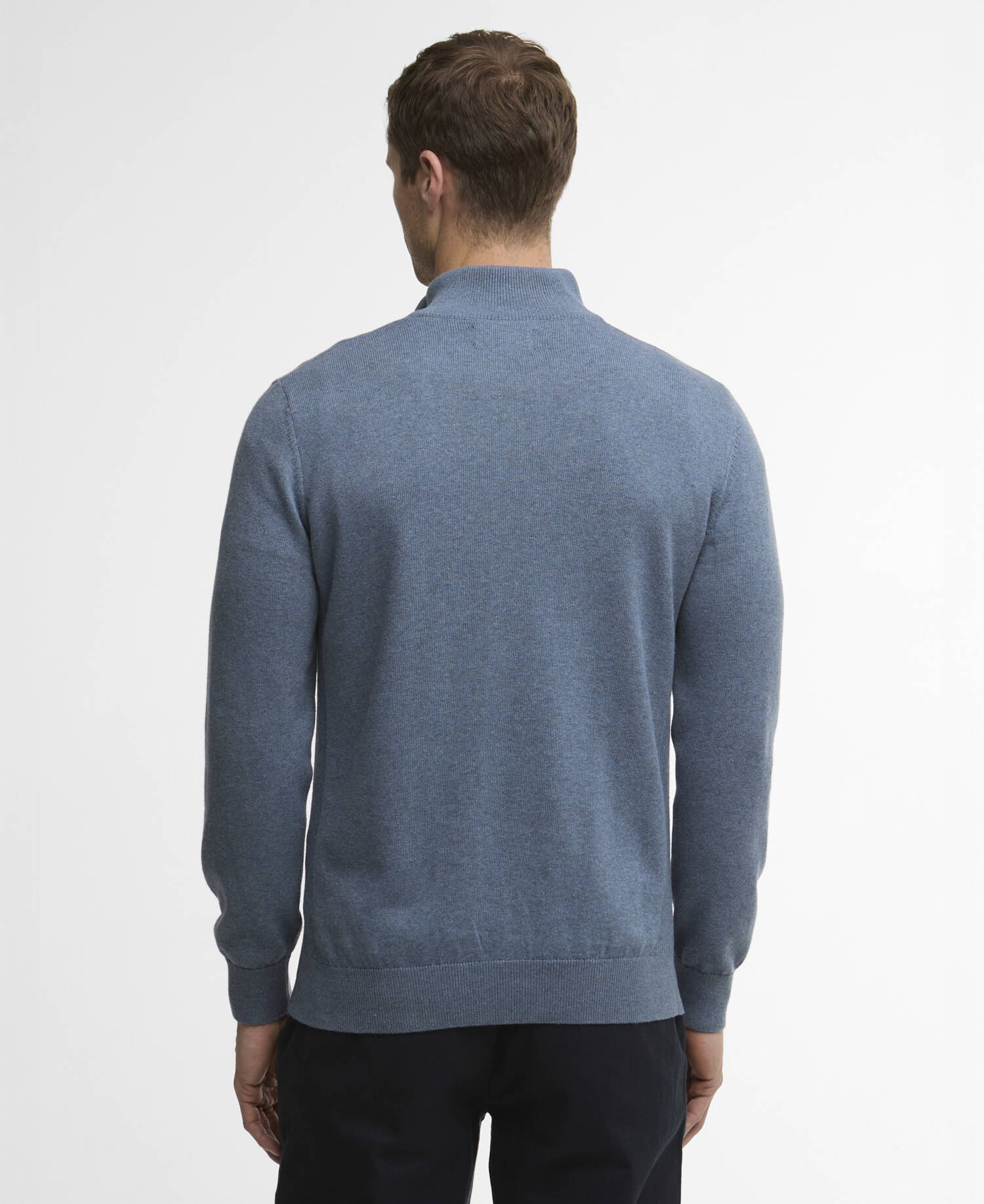 Man wearing a blue sweater on a white background