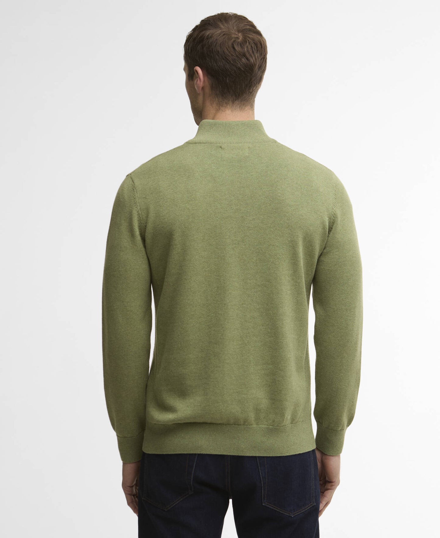 Man wearing a green sweater on a white background