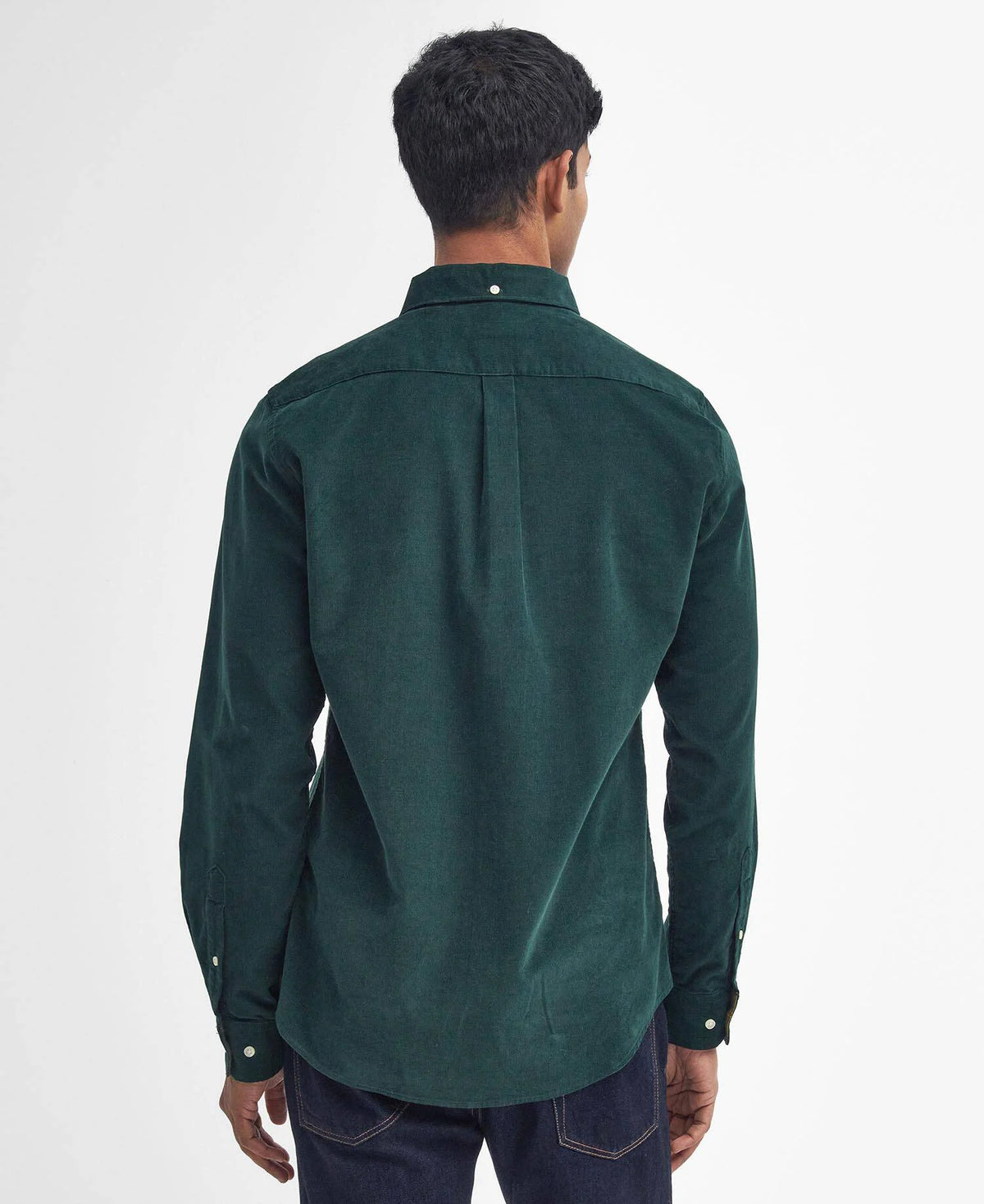 Man wearing a green shirt from behind on a white background