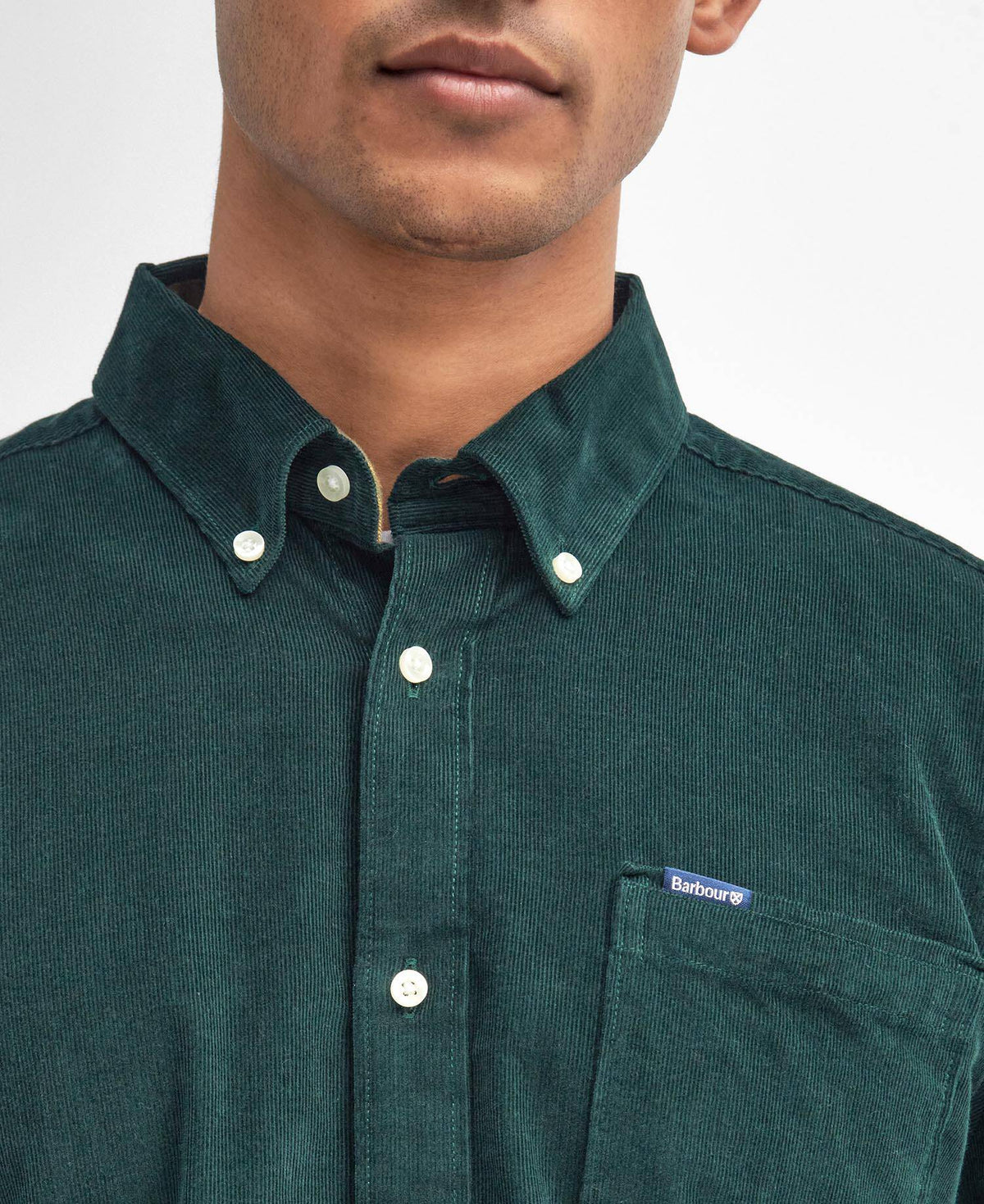 Green corduroy shirt with a Barbour brand logo on a plain background