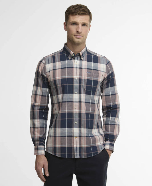 Man wearing a plaid shirt with a visible Barbour logo on a white background