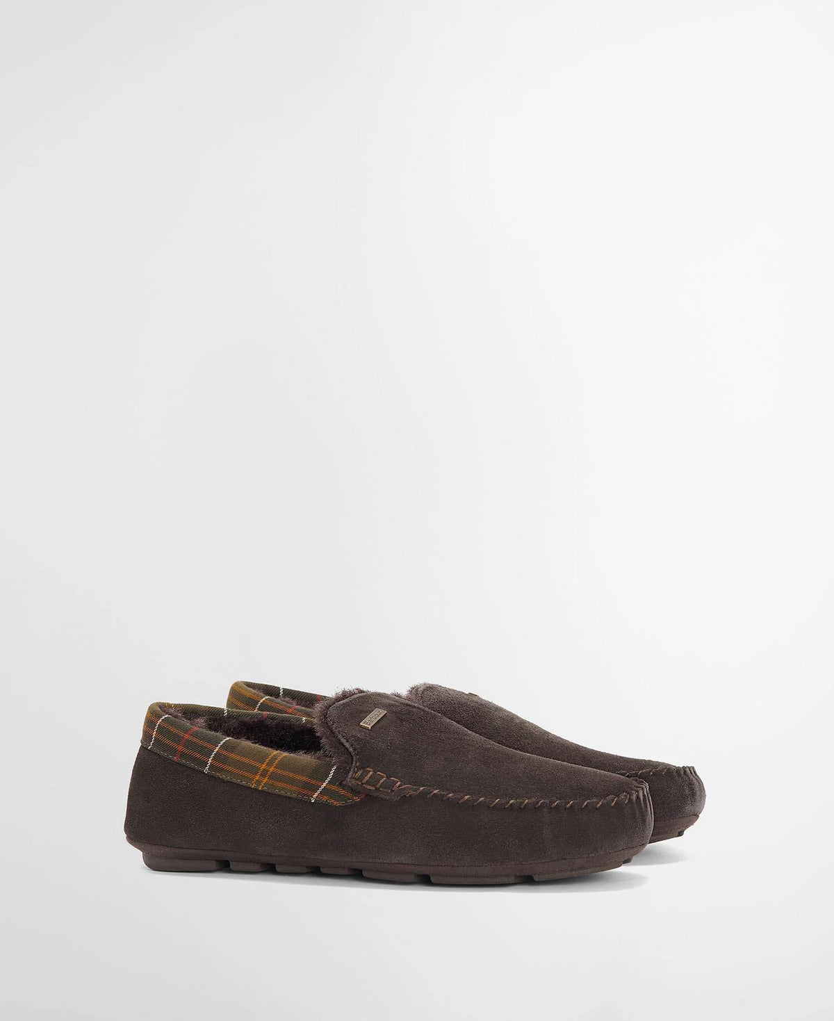 A pair of dark brown suede moccasins with a plaid lining, shown from a side profile view against a clean white background.