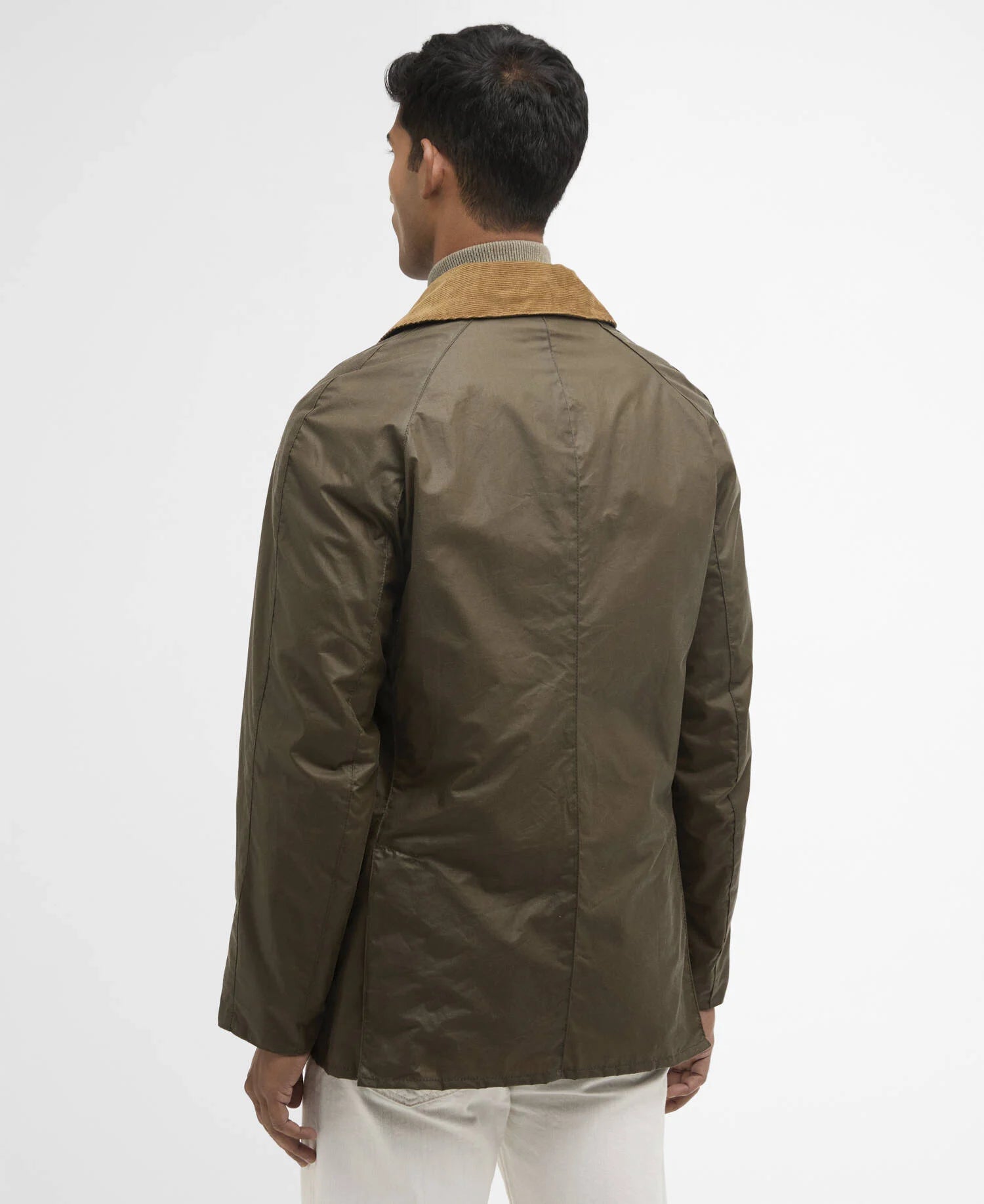 Man wearing a green jacket with a white background