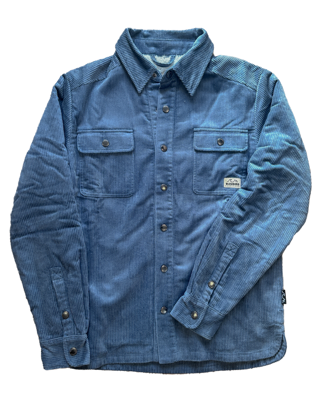 A blue corduroy button-up shirt jacket with two chest flap pockets, laid flat on a white background.