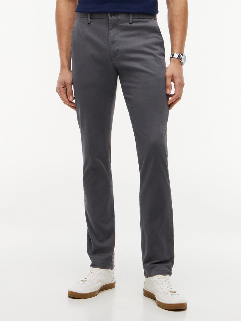 Person wearing gray pants on a white background