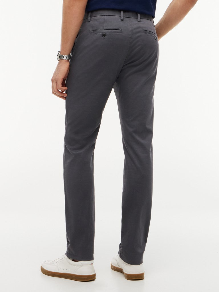 Person wearing gray pants on a white background
