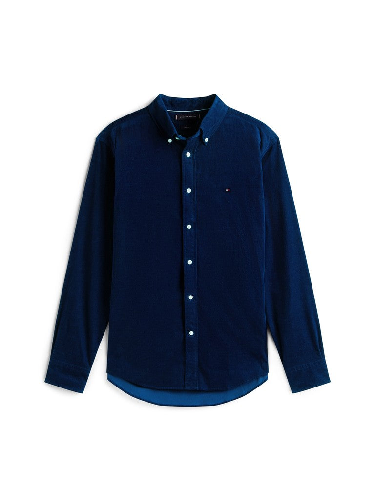 A dark navy blue long-sleeve button-down shirt with a small embroidered Tommy Hilfiger flag logo on the left chest, displayed on a clean white background.