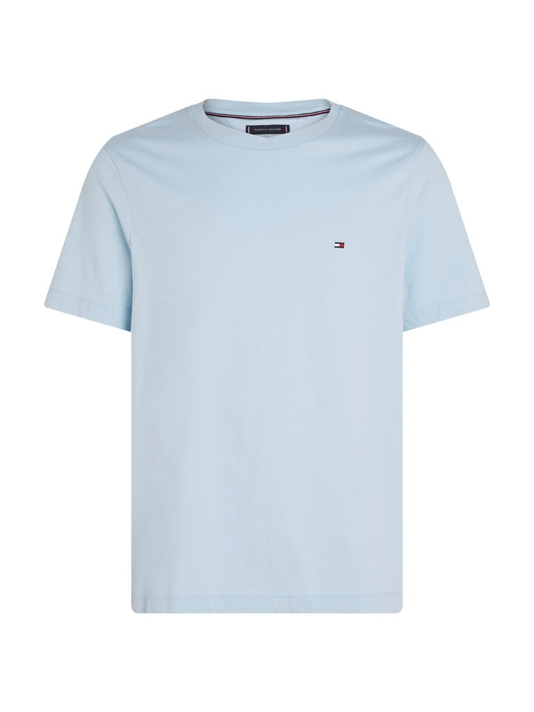 A light blue short-sleeve crewneck t-shirt with the small Tommy Hilfiger flag logo embroidered on the left chest, displayed on a clean white background.