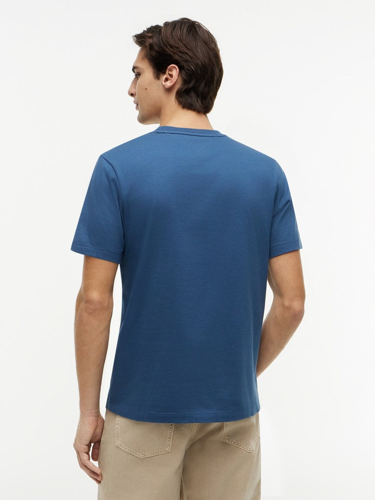 Man wearing a blue t-shirt on a white background