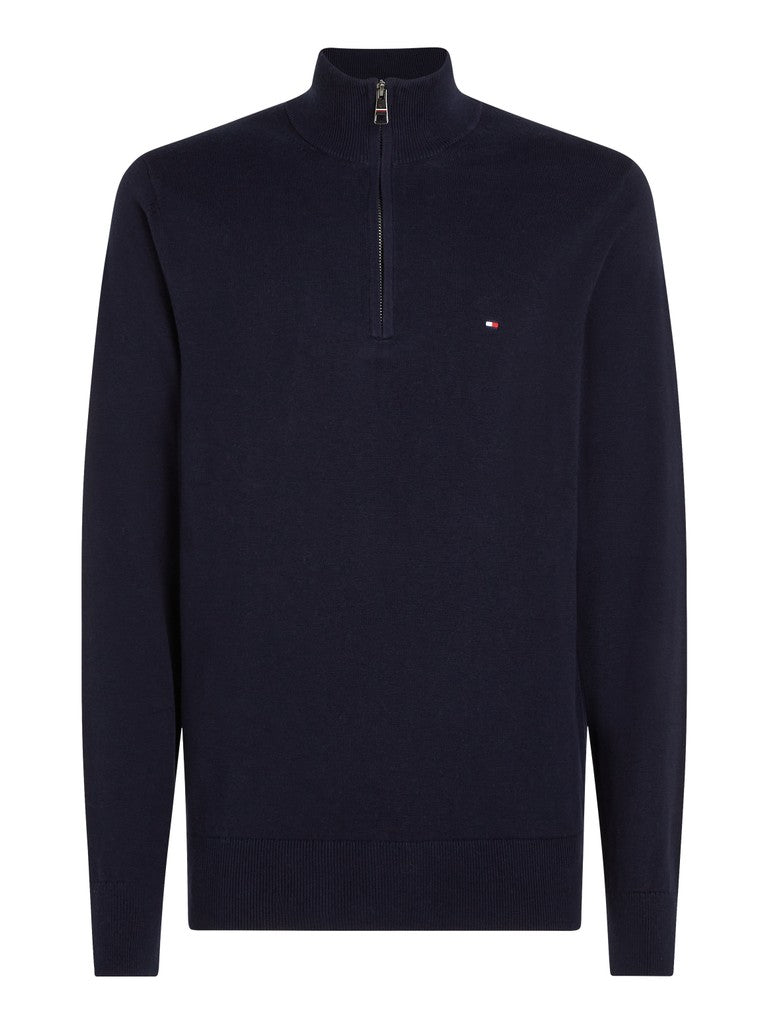 A navy blue long-sleeve quarter-zip pullover sweater with a small embroidered Tommy Hilfiger flag logo on the left chest, shown on a plain white background.