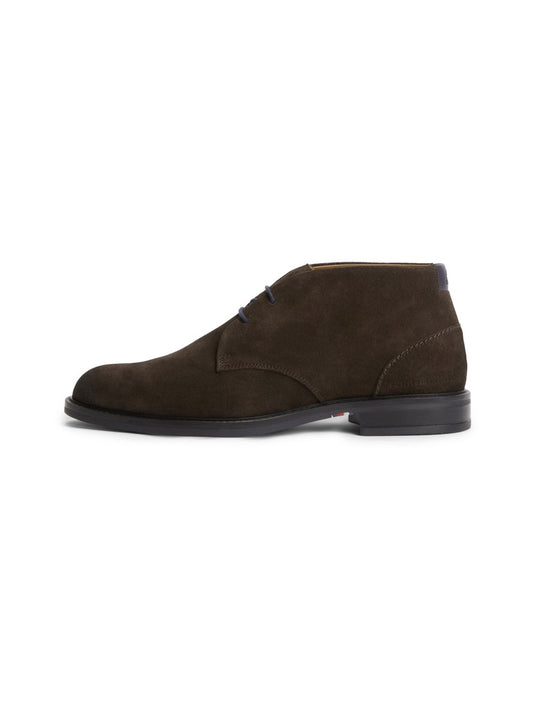 Men's dark brown suede ankle boot from the side with black sole and navy lace