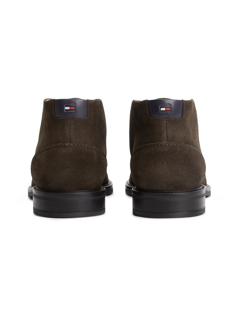 A pair of Tommy Hilfiger suede ankle boots in dark brown, shown from the back on a clean white background.