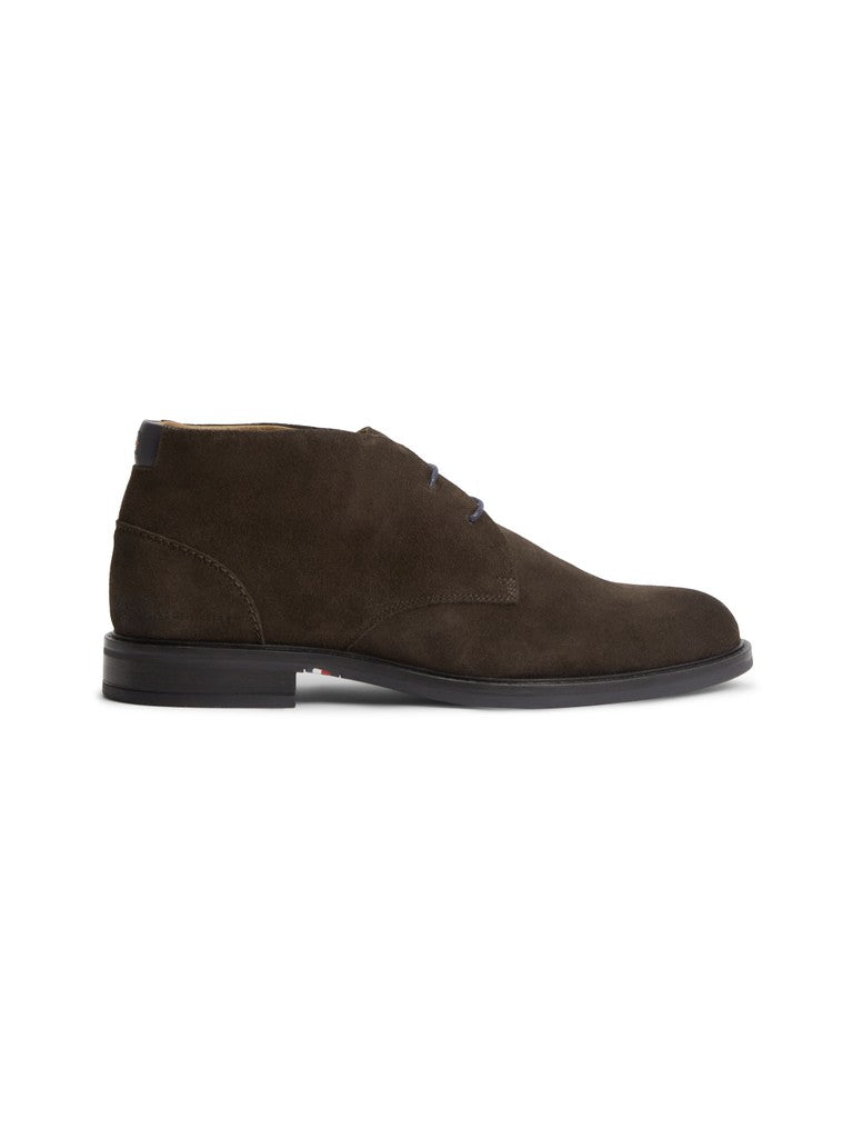 A single men's ankle boot with a dark brown suede finish, black laces, and a black sole, shown in a side profile on a white background