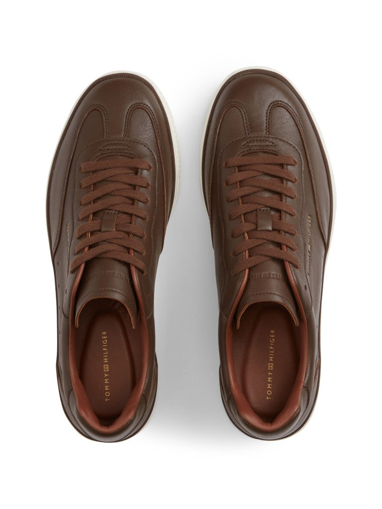 A pair of brown leather low-top sneakers shown from a top-down view on a clean white background.