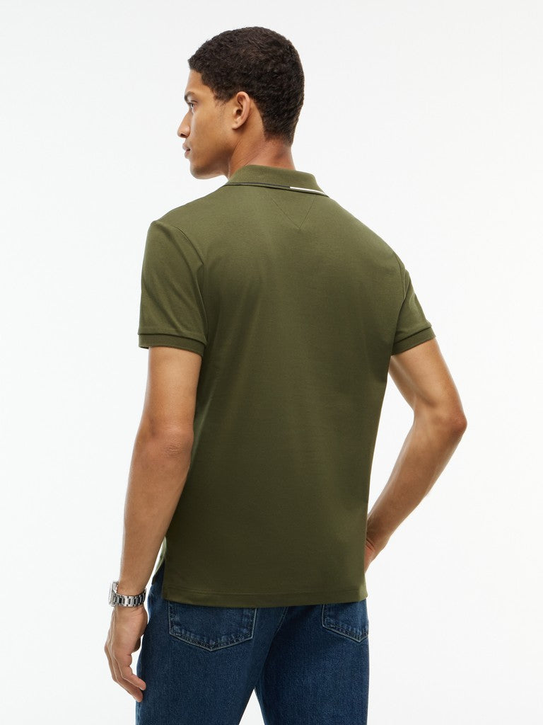 A man wearing an olive green short-sleeve polo shirt, shown from the back against a plain white background.