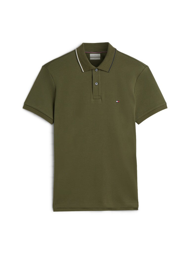 An olive green short-sleeve polo shirt with a white and dark green striped collar and a small embroidered Tommy Hilfiger flag logo on the left chest, displayed on a clean white background.