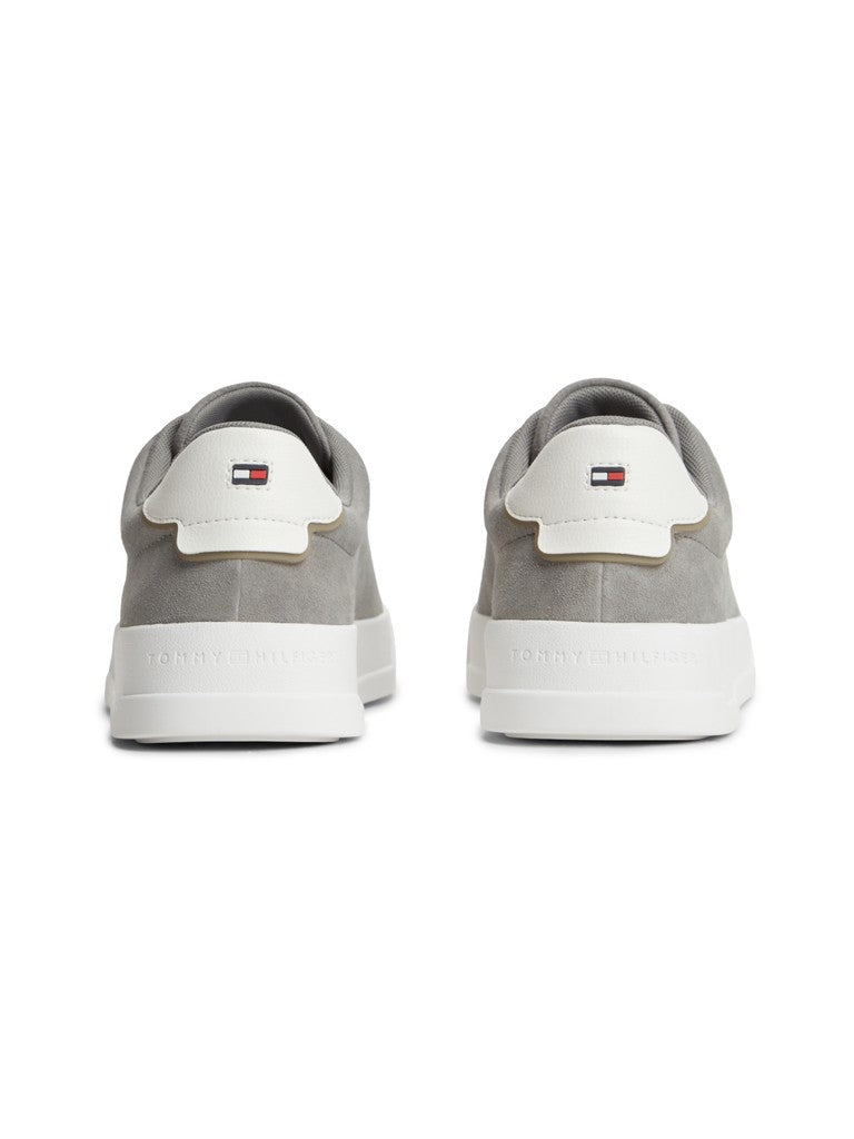 Pair of grey Tommy Hilfiger sneakers from the back with Hilfiger flag logo on the heel tab