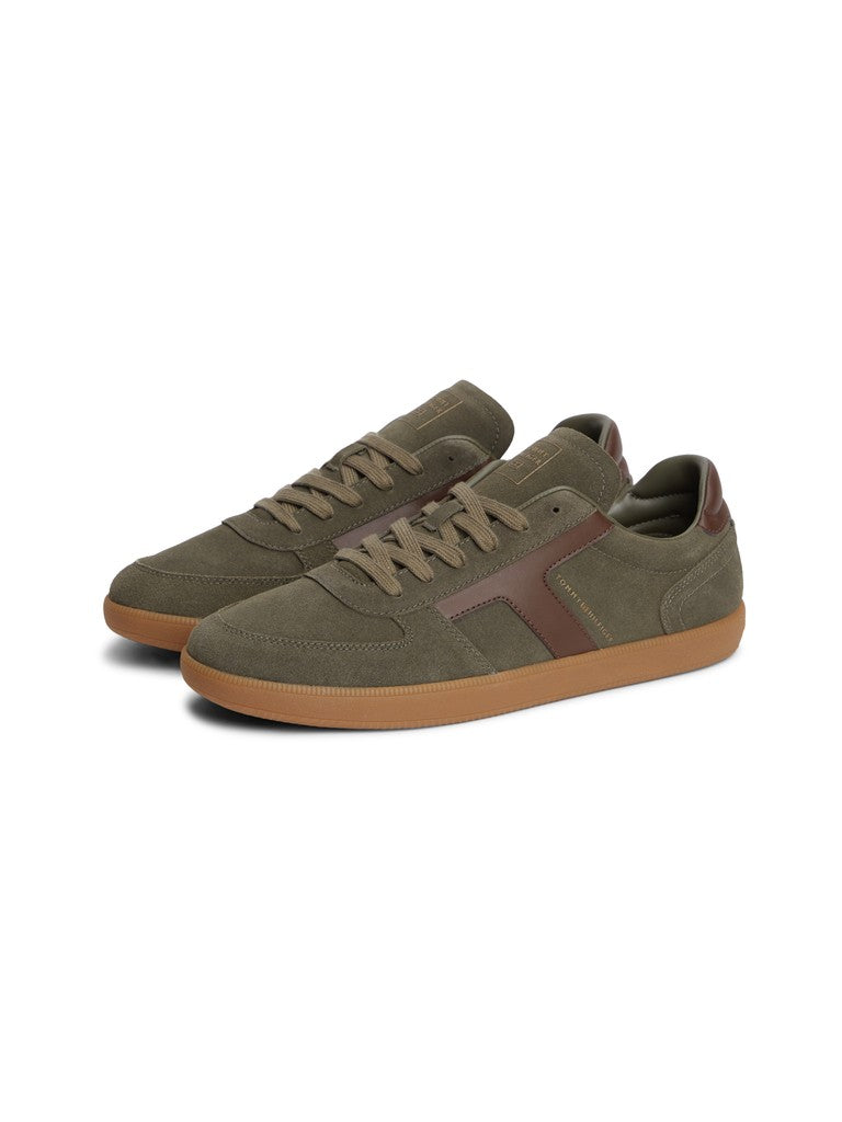 A pair of low-top sneakers in olive green suede with brown leather side stripes and gum soles, shown on a plain white background.