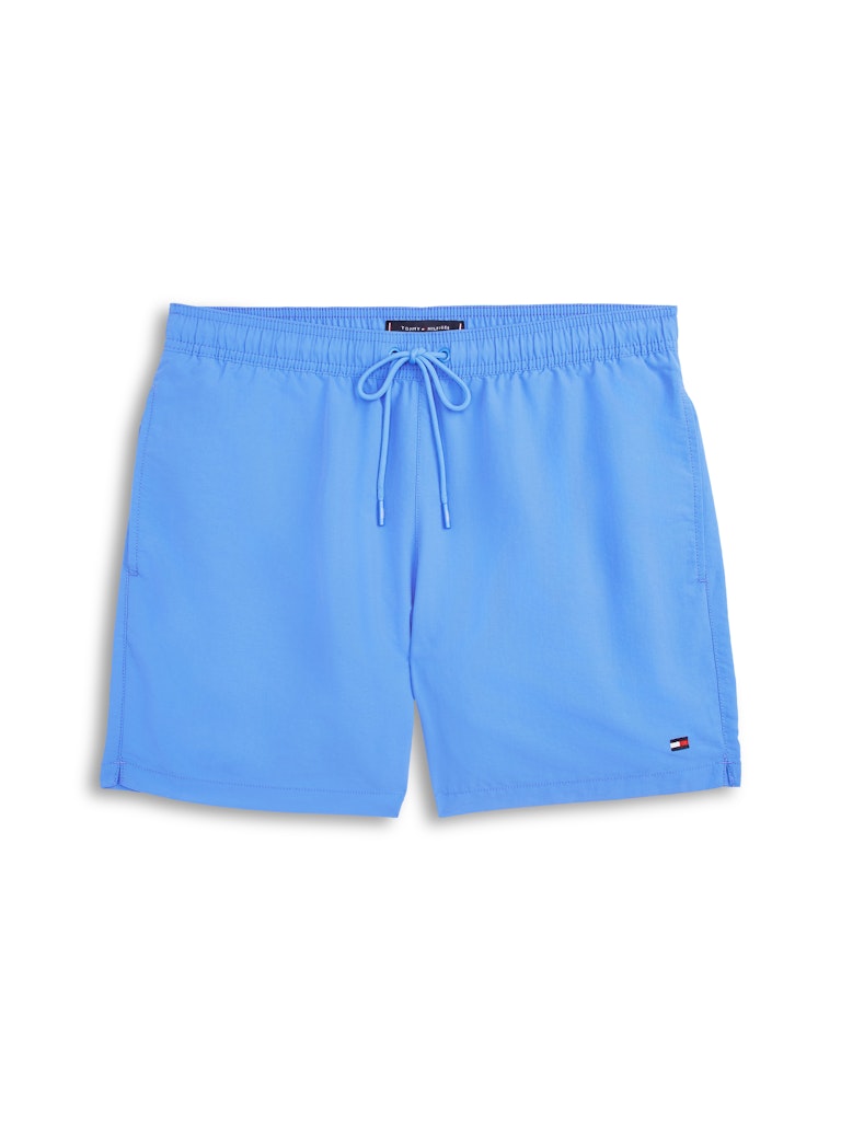 Light blue Tommy Hilfiger swim trunks with an elastic waistband and drawstring, shown flat on a white background.