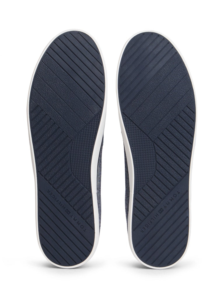 Sole view of casual shoe with a Tommy Hilfiger logo