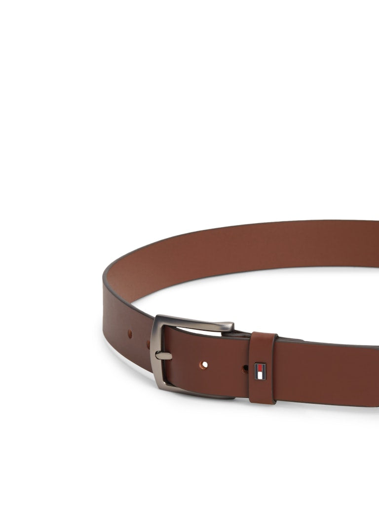 Brown belt with a silver buckle on a white background