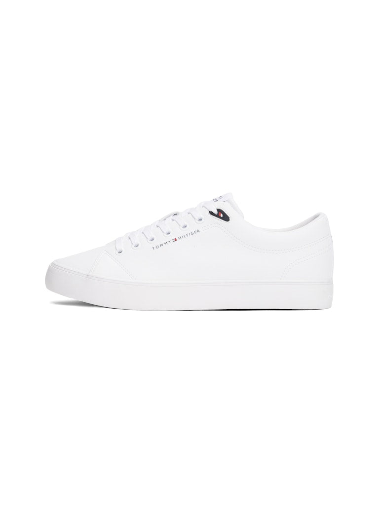 White sneaker with Tommy Hilfiger logo on a white background