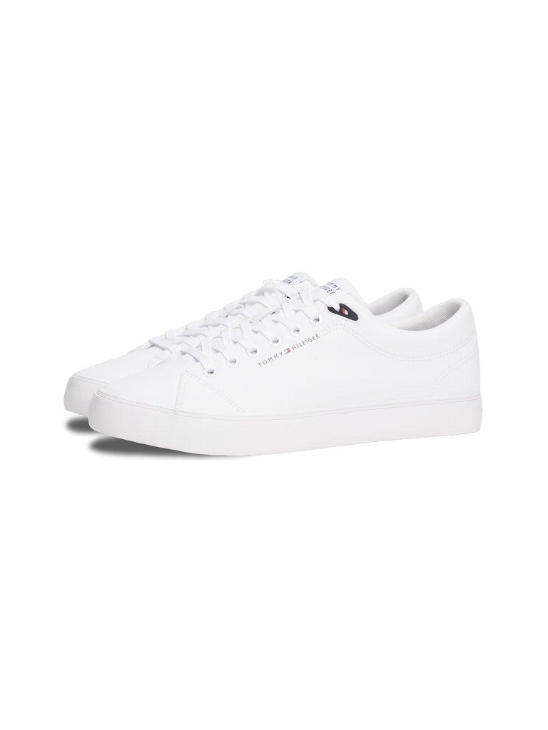 White sneaker with Tommy Hilfiger logo on a white background