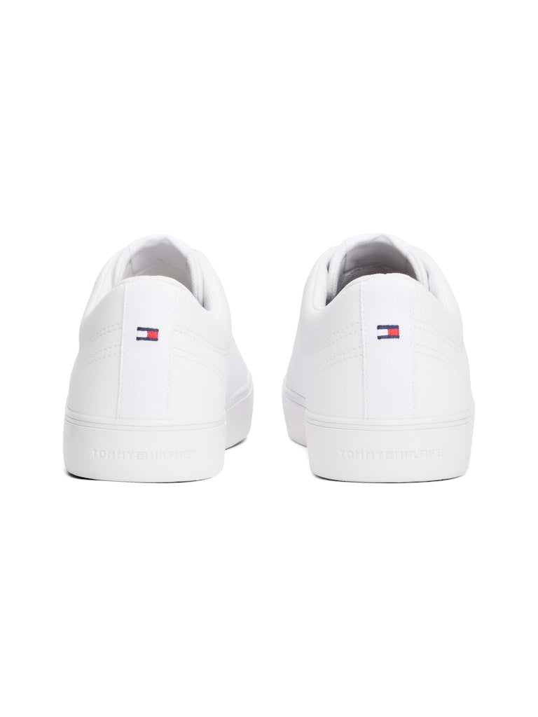 White sneakers with Tommy Hilfiger logo on a white background