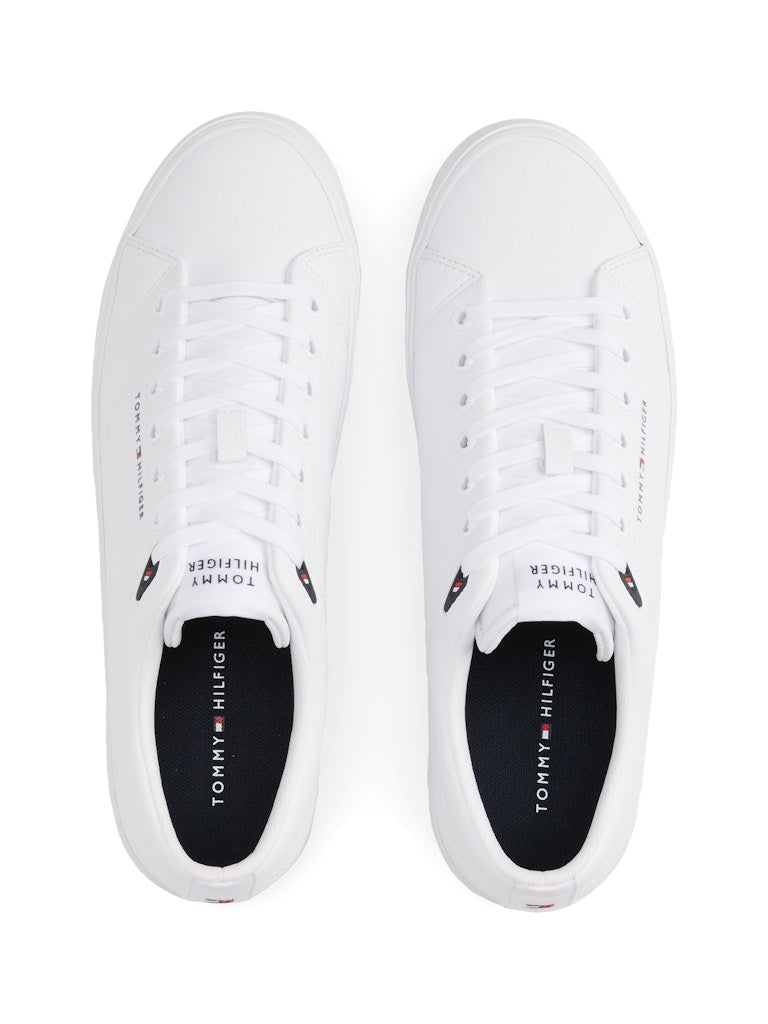 White sneakers with Tommy Hilfiger logo on a white background