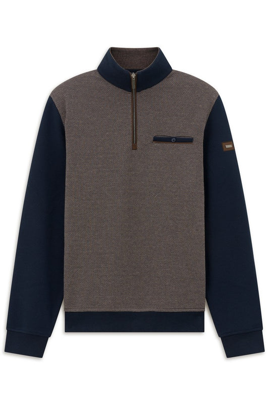 A men's colorblock quarter-zip pullover sweater with a heathered brown body, navy blue collar, sleeves, and hem, featuring a chest pocket with a snap tab and a small brown sleeve patch.