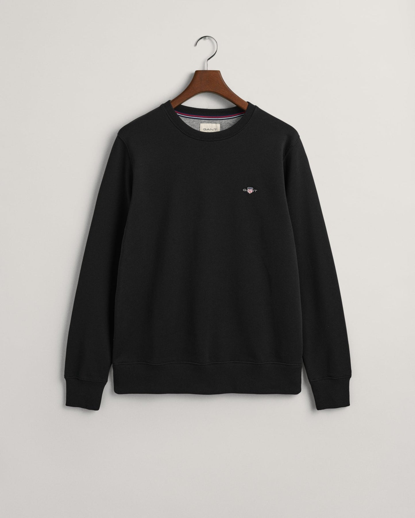 GANT Shield Crew Neck Sweatshirt on hanger, front, Black - Matt O'Brien Fashions