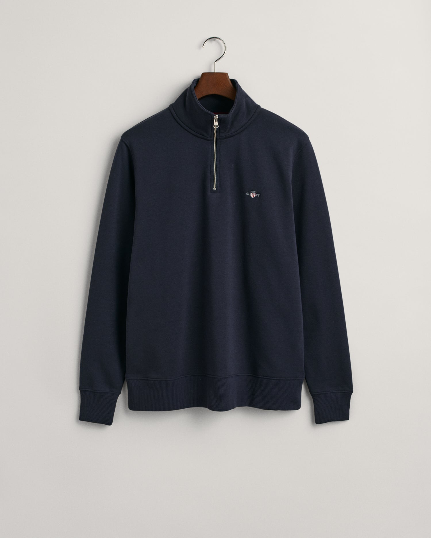 GANT Regular Shield Half Zip Sweatshirt on hanger, front, evening blue - Matt O'Brien Fashions